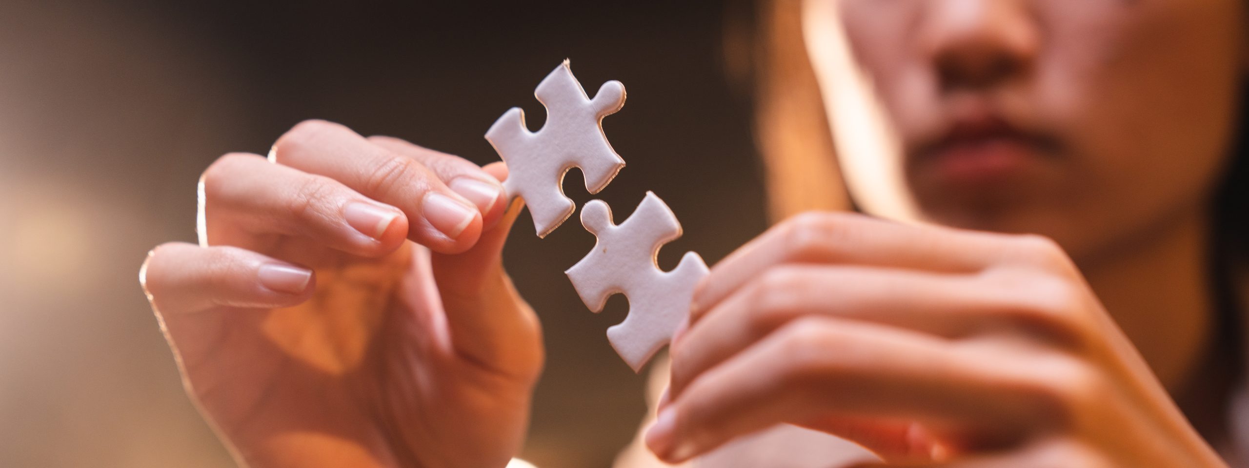 Concept of integration and startup with puzzle pieces merger with teamwork of business worker