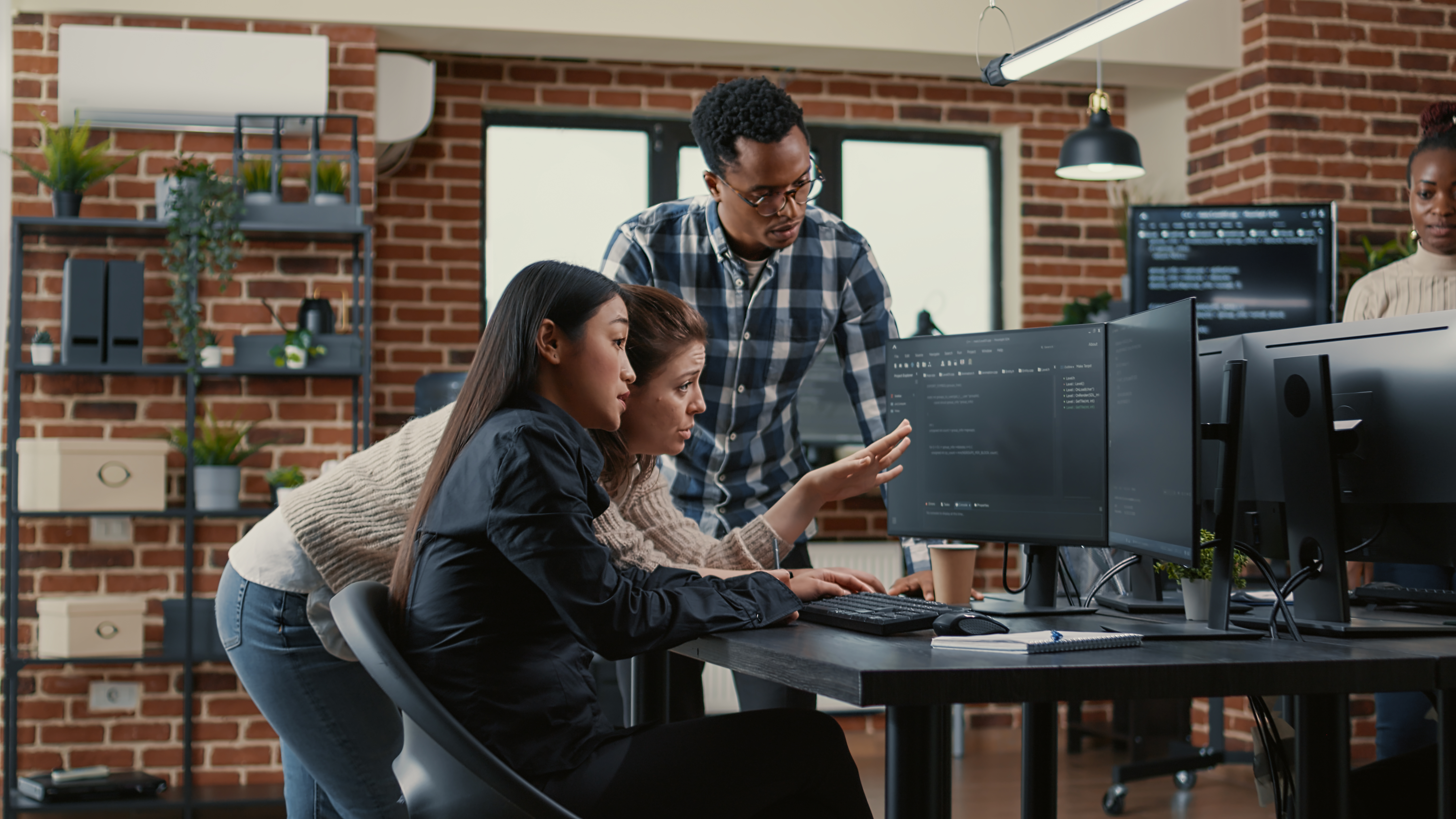 Mixed team of software engineers brainstorming ideas for new cloud computing user interface