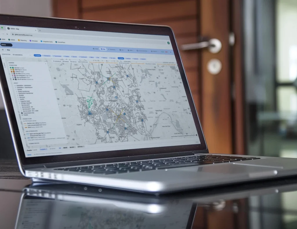 Grid Data Enhanced Analytics network map open on a laptop